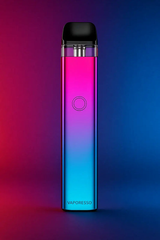 A Vaporesso XROS 3 pod kit  vape device with a sleek gradient finish transitioning from vibrant magenta at the top to electric blue at the bottom, standing upright against a matching background that blends deep red, purple, and blue hues. The device features a circular button on the front and a glossy, modern design.